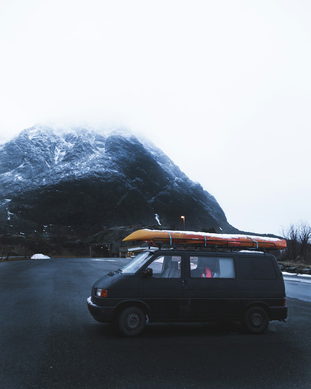 black suv on road near mountain during daytime