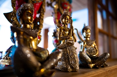 Close-up of intricately designed ornamental statues and timeless collectibles.
