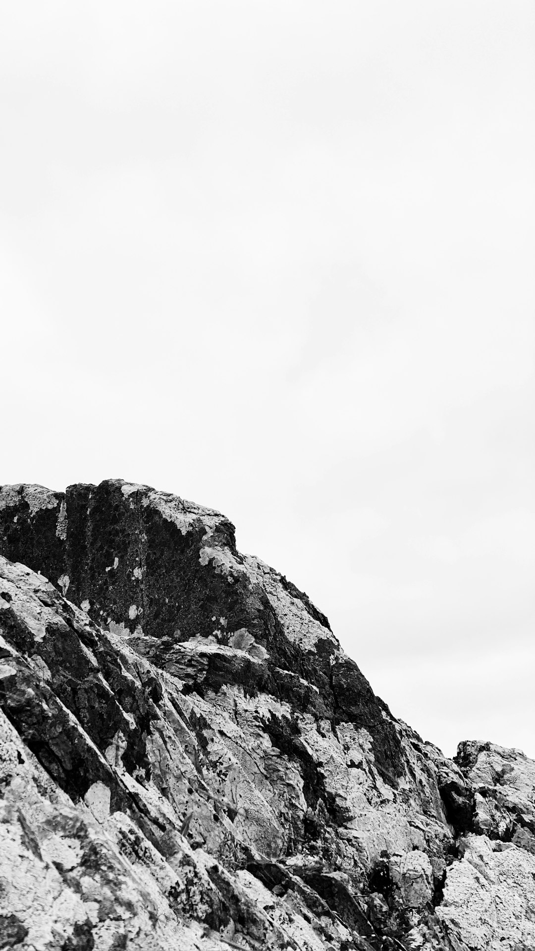 gray rocky mountain under white sky during daytime