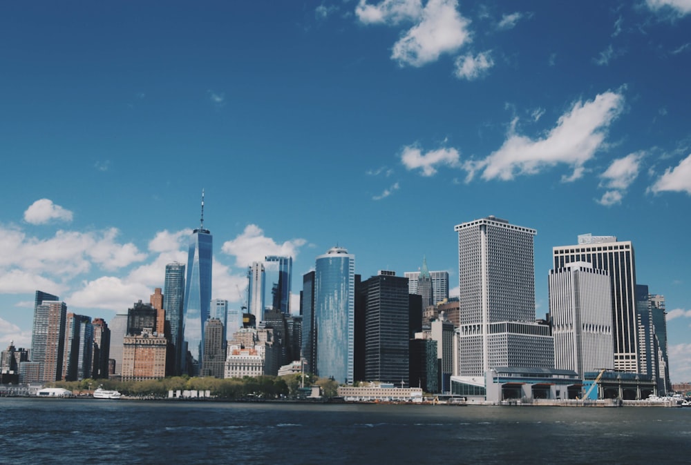 city skyline under blue sky during daytime