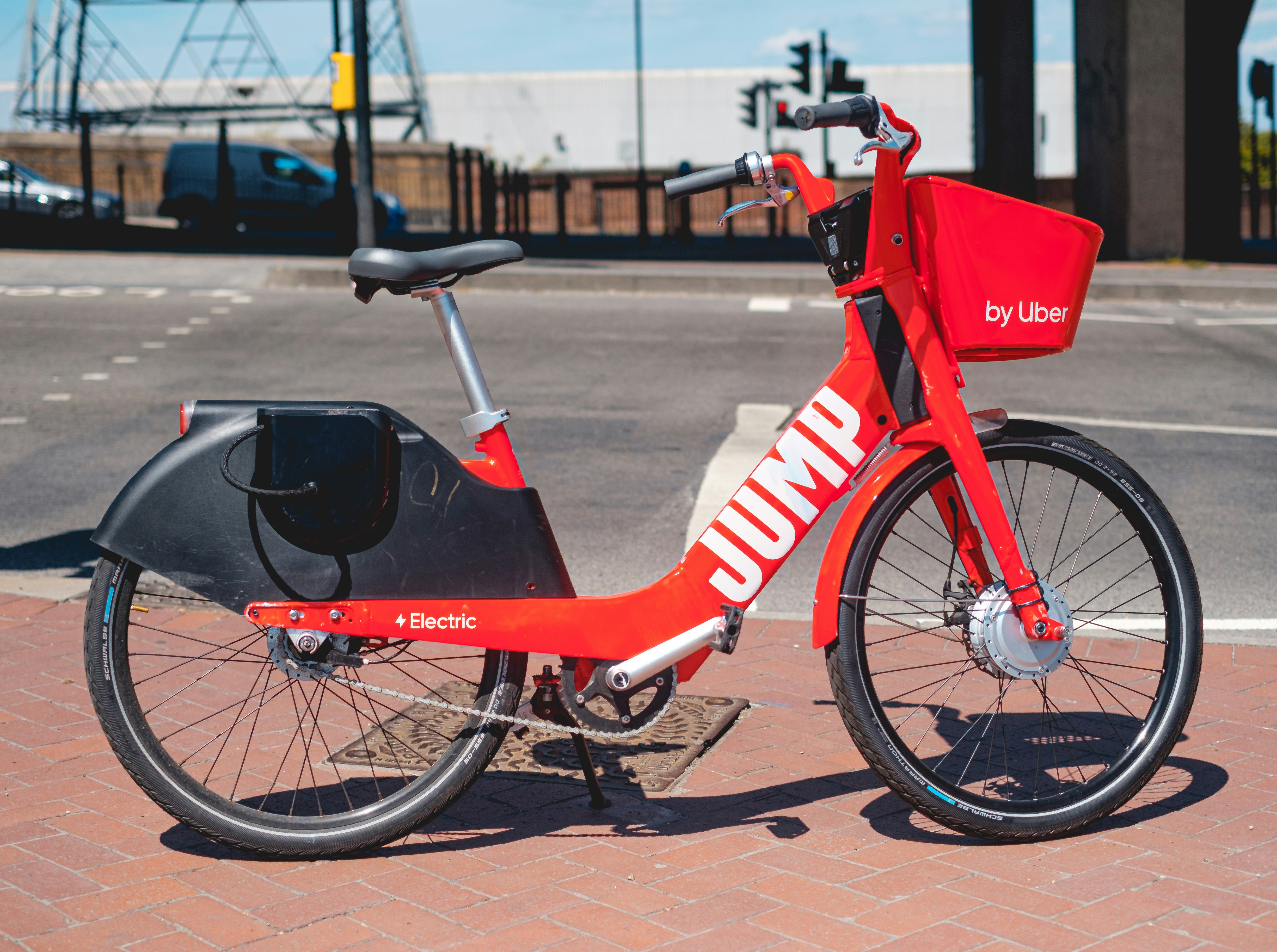 red and white bicycle on brown concrete floor during daytime