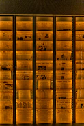 Historic newspaper clippings underlaid with glowing Afrofuturist patterns.
