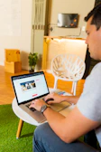person in white shirt using macbook air