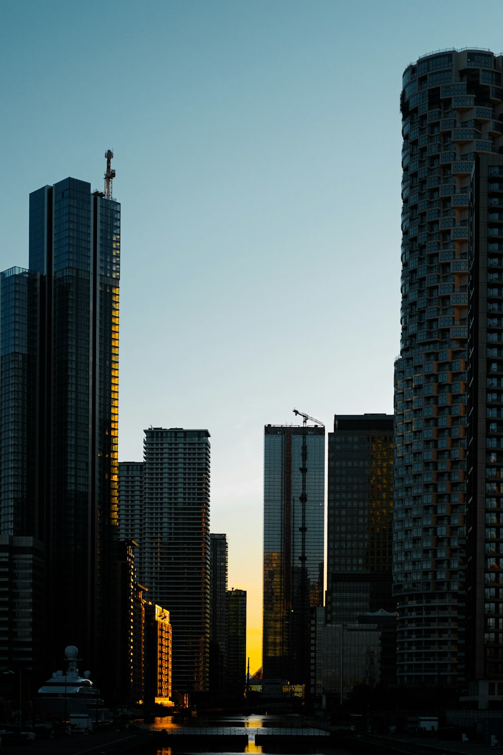 silhouette of man standing on top of building during sunset