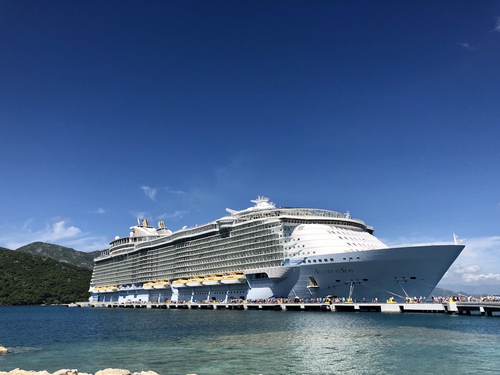 white cruise ship on sea under blue sky during daytime