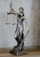 gold angel figurine on white surface
