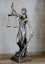 gold angel figurine on white surface