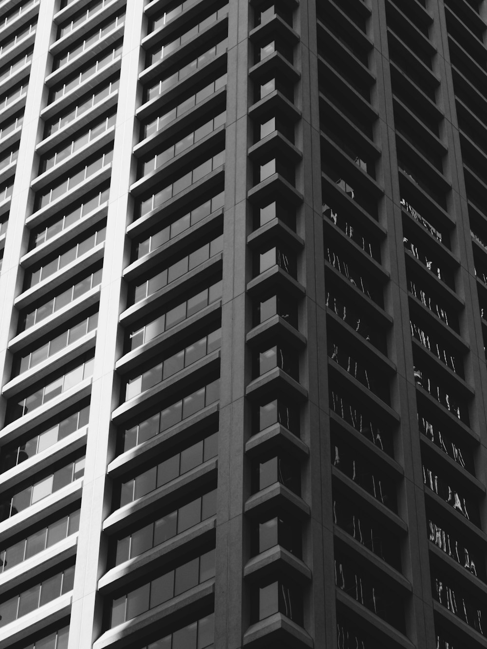 a black and white photo of a tall building