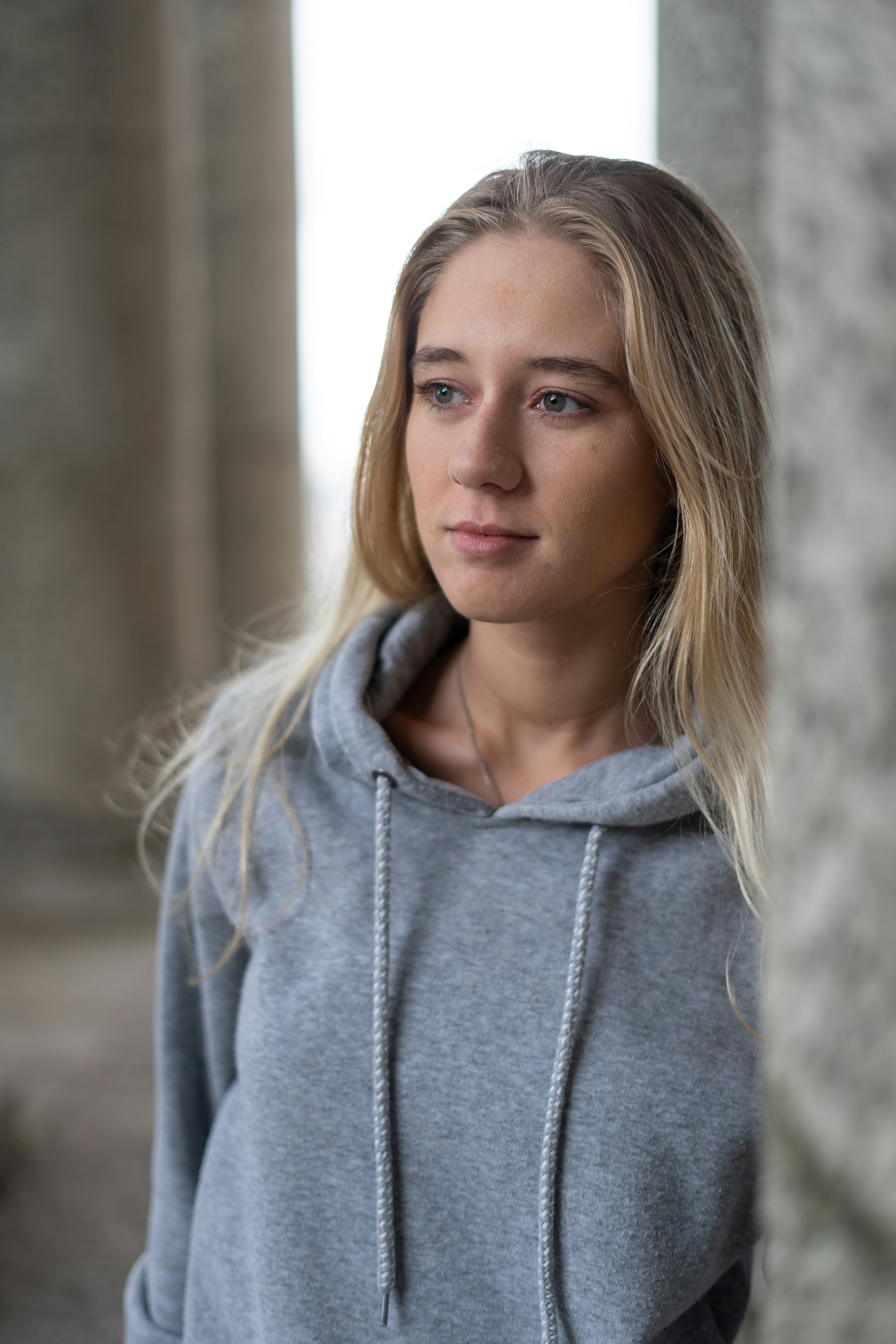 woman in gray hoodie standing