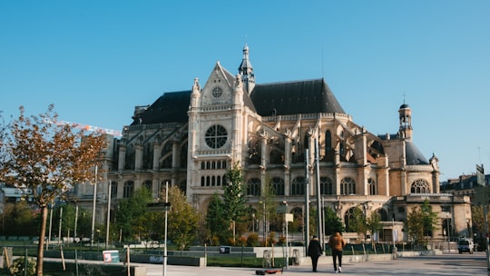 people walking near brown concrete building during daytime in Église Saint-Eustache France