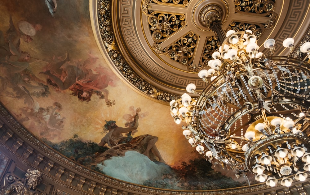 gold and white chandelier on ceiling