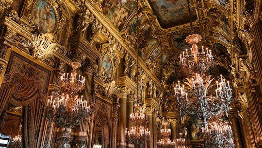 gold and blue cathedral interior in Palais Garnier France