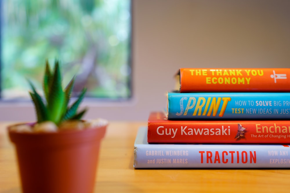 books on brown wooden table