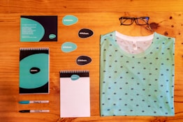 black framed eyeglasses beside white paper