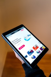black android smartphone turned on displaying icons