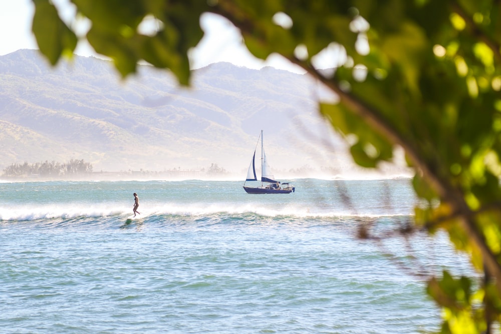 person surfing on sea during daytime