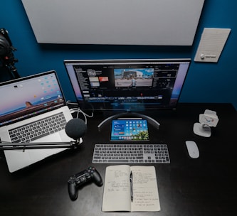 black flat screen computer monitor and black computer keyboard