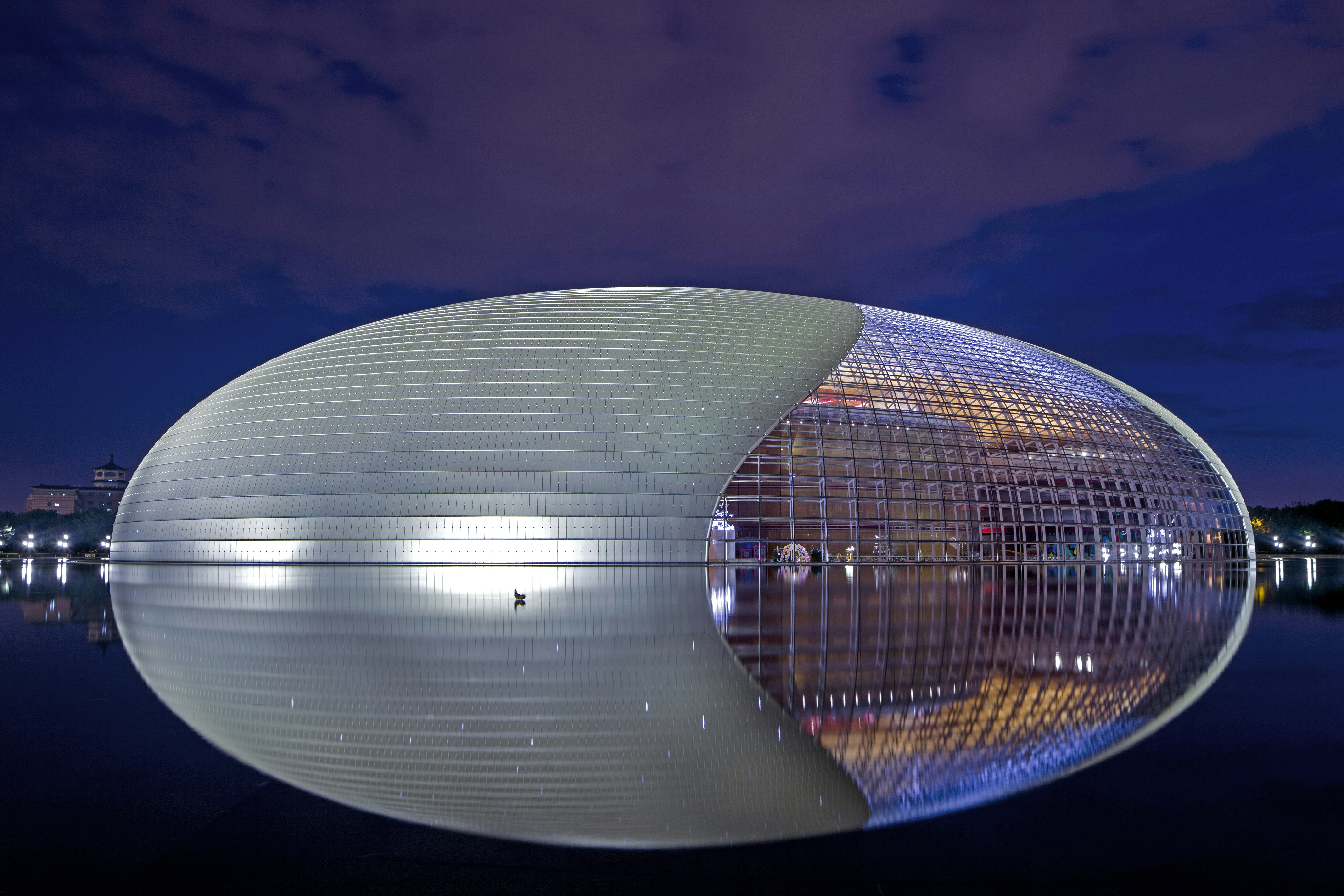 clear glass round building during night time