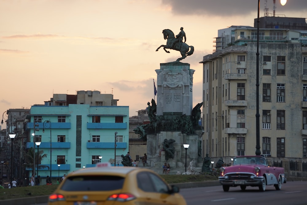 cars on road near buildings during daytime