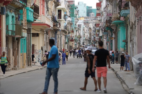 people walking on street during daytime in Havana Cuba