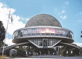 gray and white concrete building under blue sky during daytime