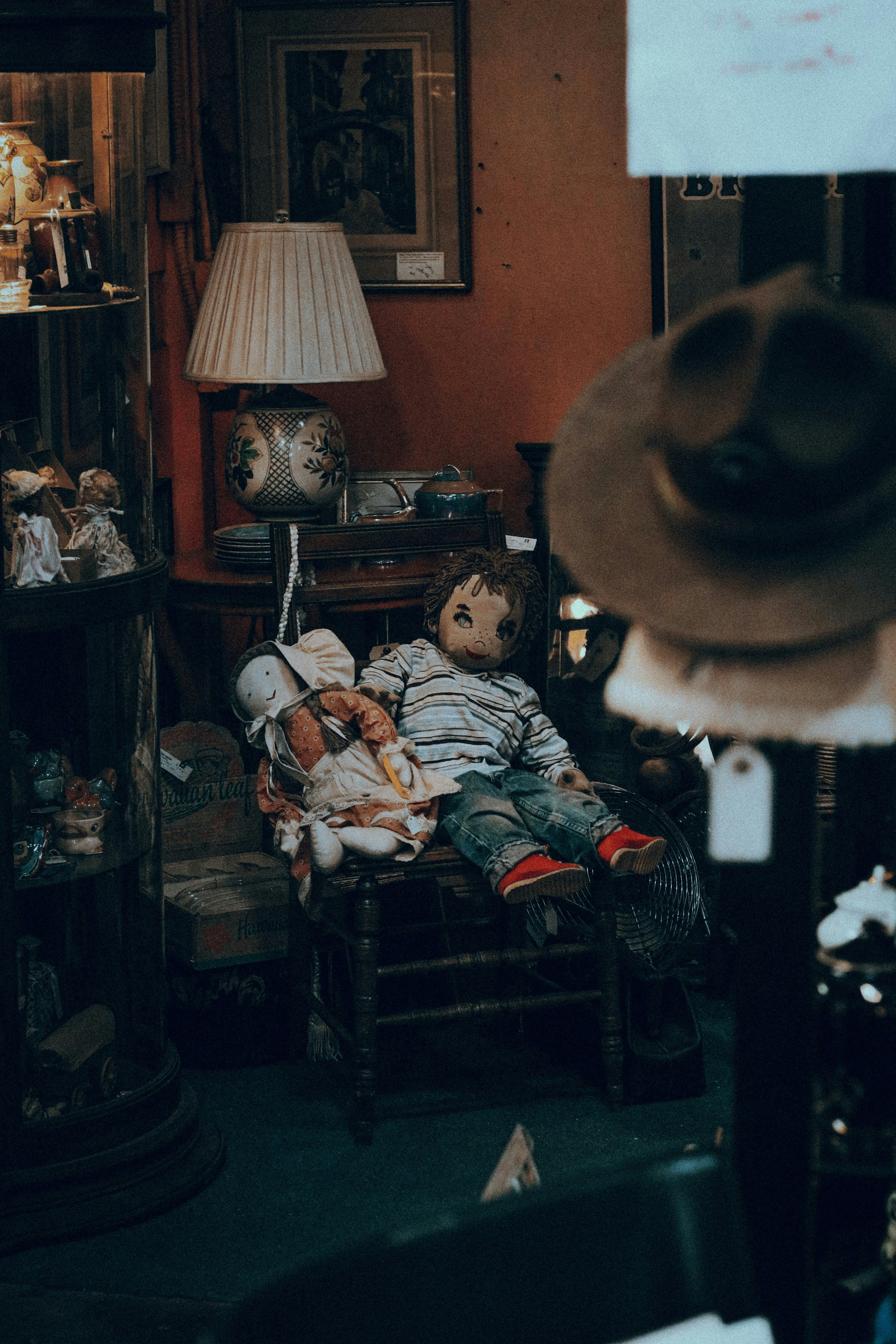 a teddy bear sitting on a chair in a room