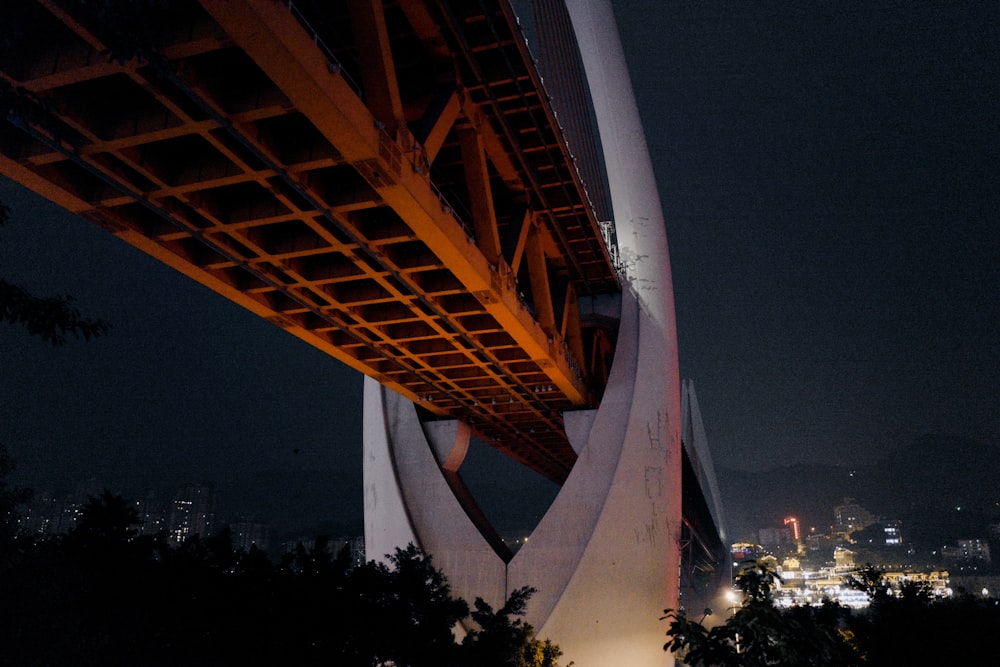 orange metal tower during night time