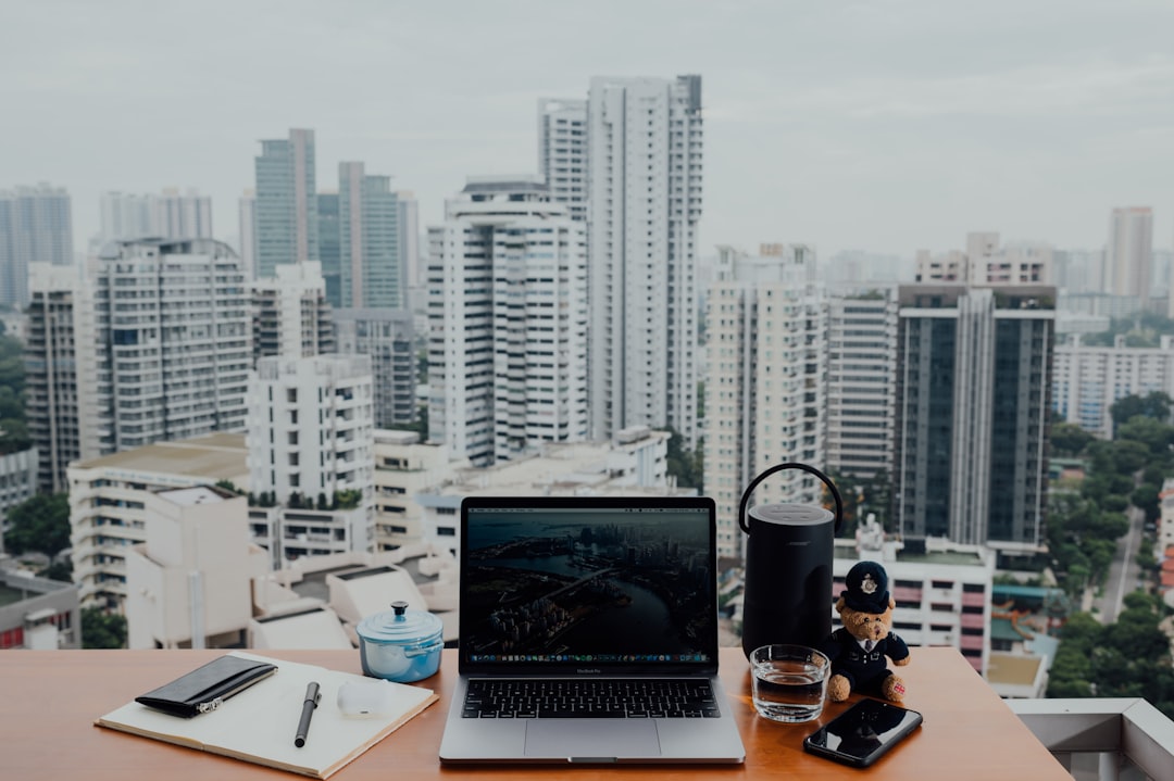 macbook pro on brown wooden table