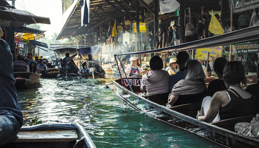 people riding on boat during daytime