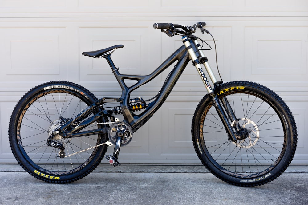 a bike parked in front of a garage door