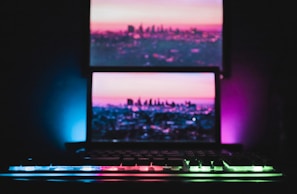 A sleek, dark-themed workspace with glowing blue and orange neon lights.