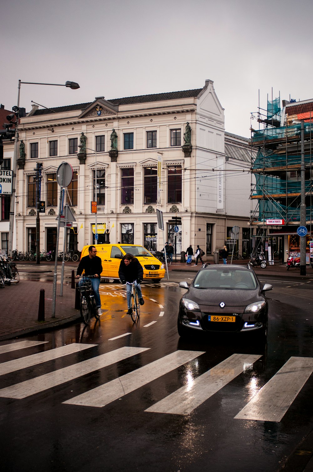 black car on road near building during daytime