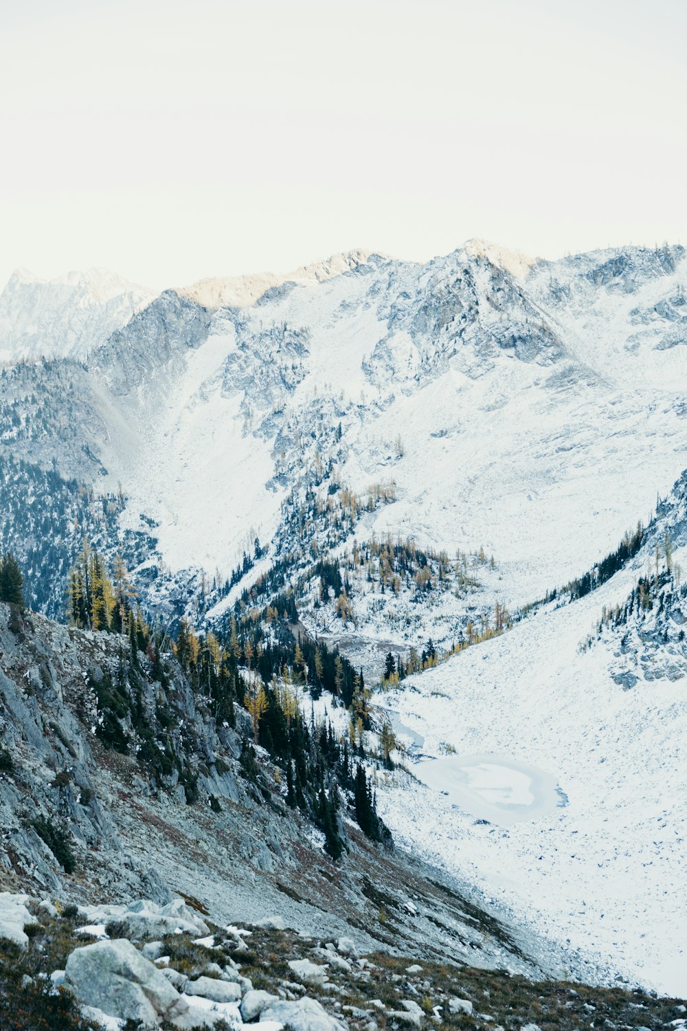 snow covered mountain during daytime