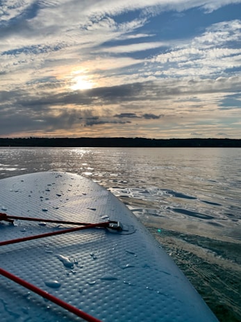 body of water under cloudy sky during daytime