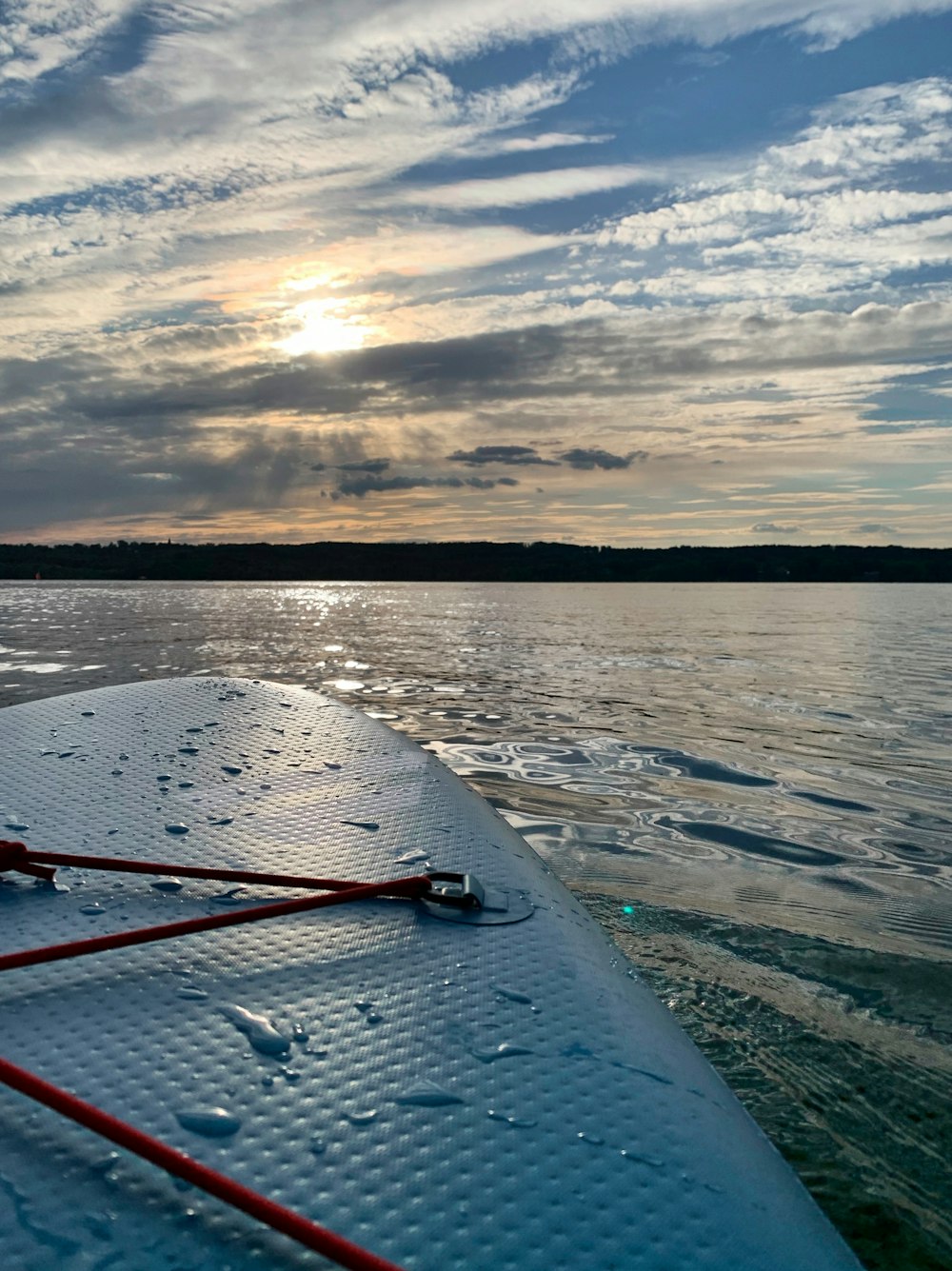 body of water under cloudy sky during daytime