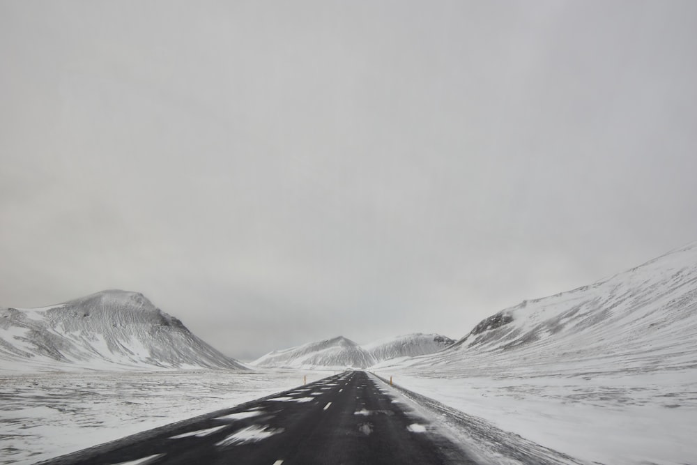 snow covered mountain under white sky during daytime