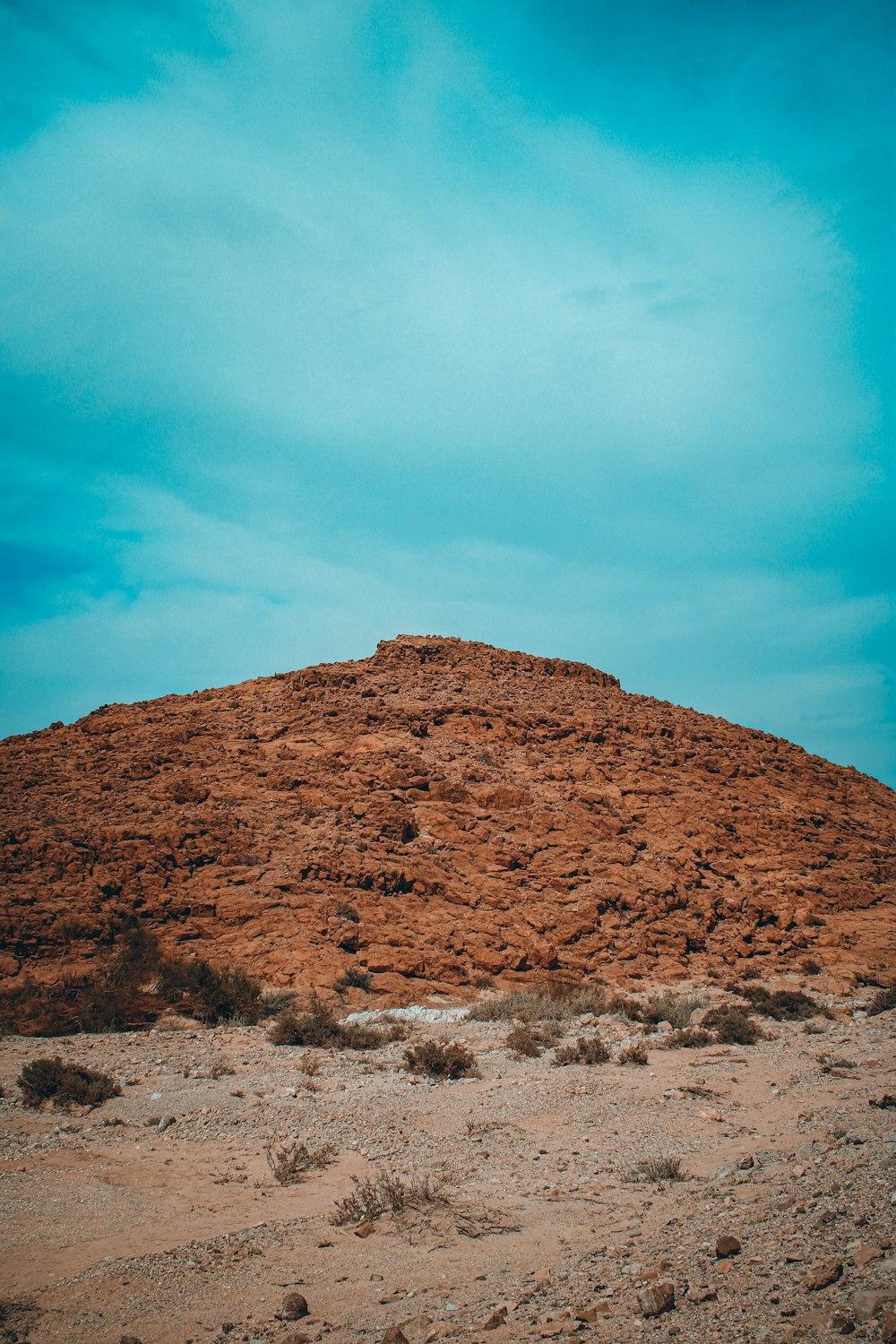 brown mountain under blue sky during daytime