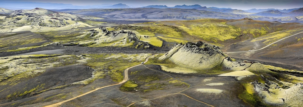 green and black mountain under white sky during daytime