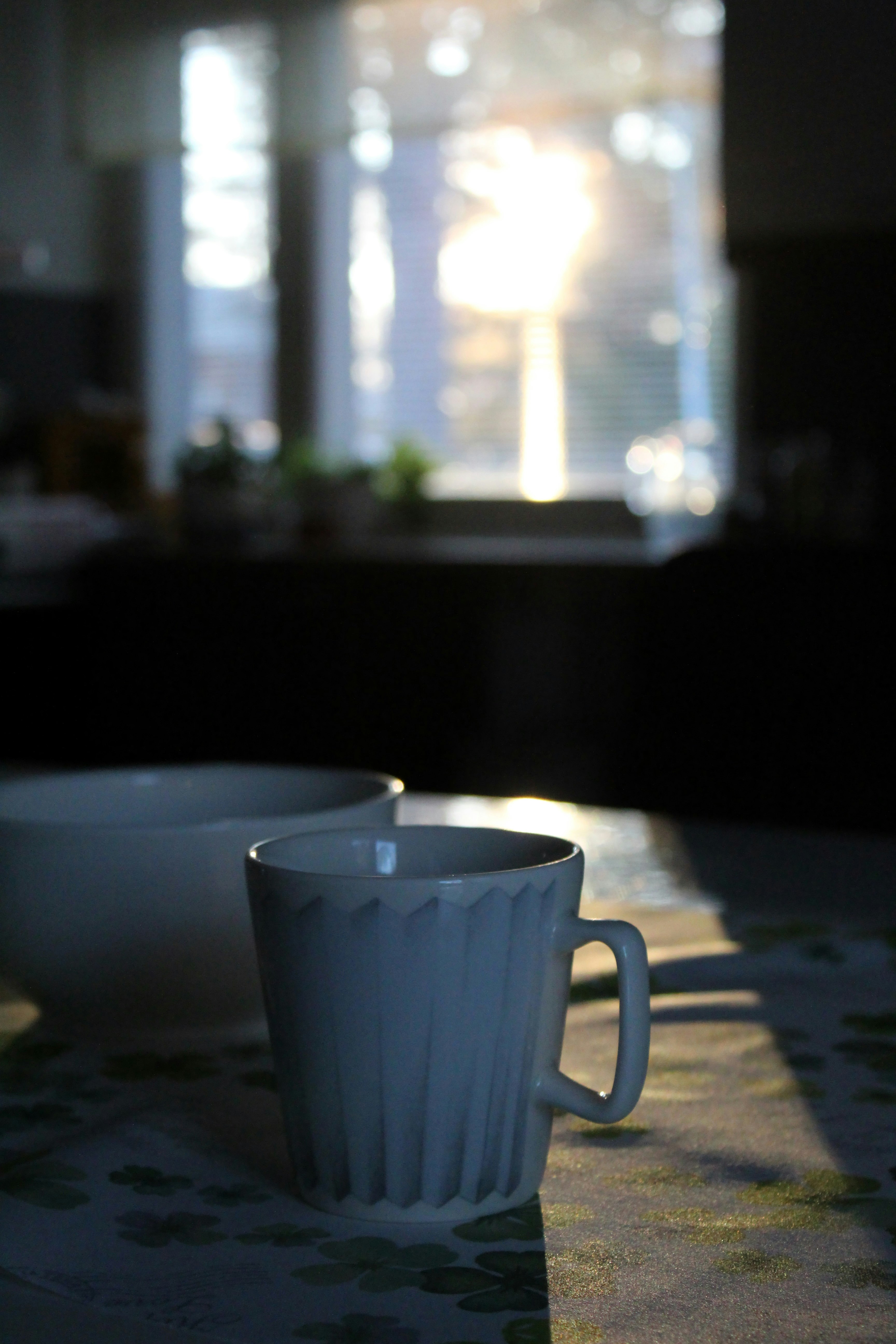 white ceramic mug on table