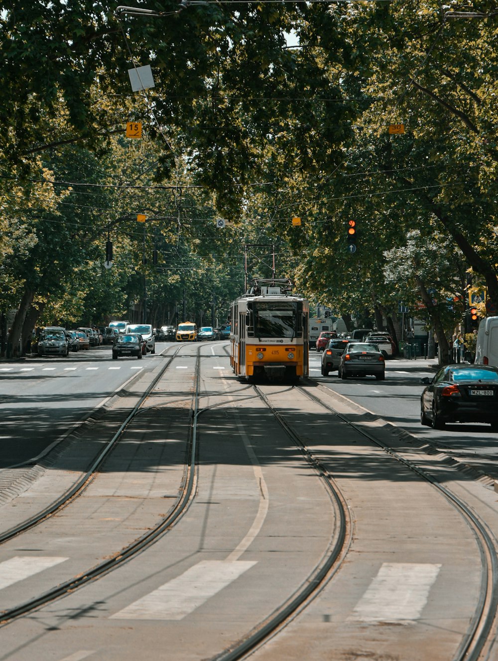 yellow bus on road during daytime
