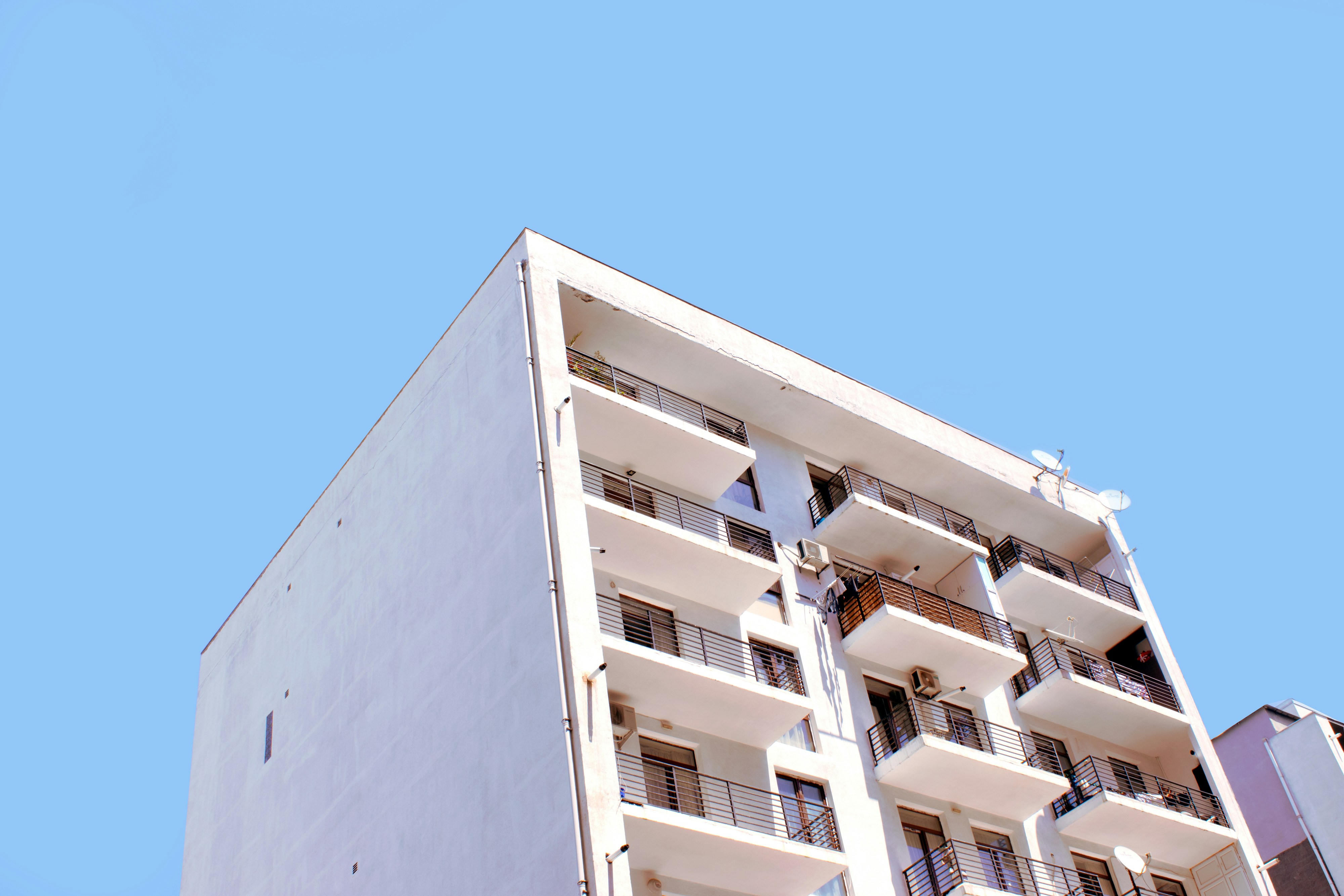 white concrete building under blue sky during daytime
