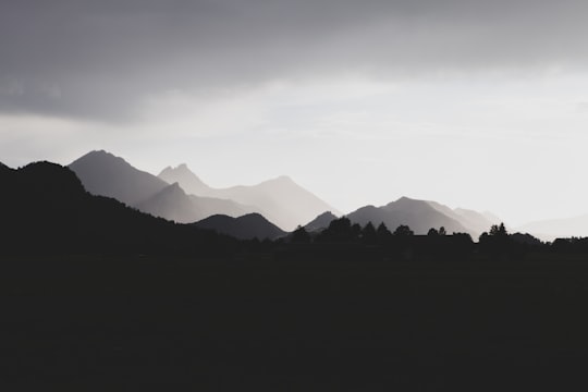 silhouette of mountains during daytime in Füssen Germany