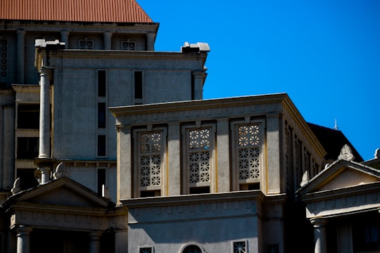 brown concrete building under blue sky during daytime in Thane India