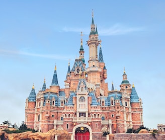 brown and blue concrete castle under blue sky during daytime