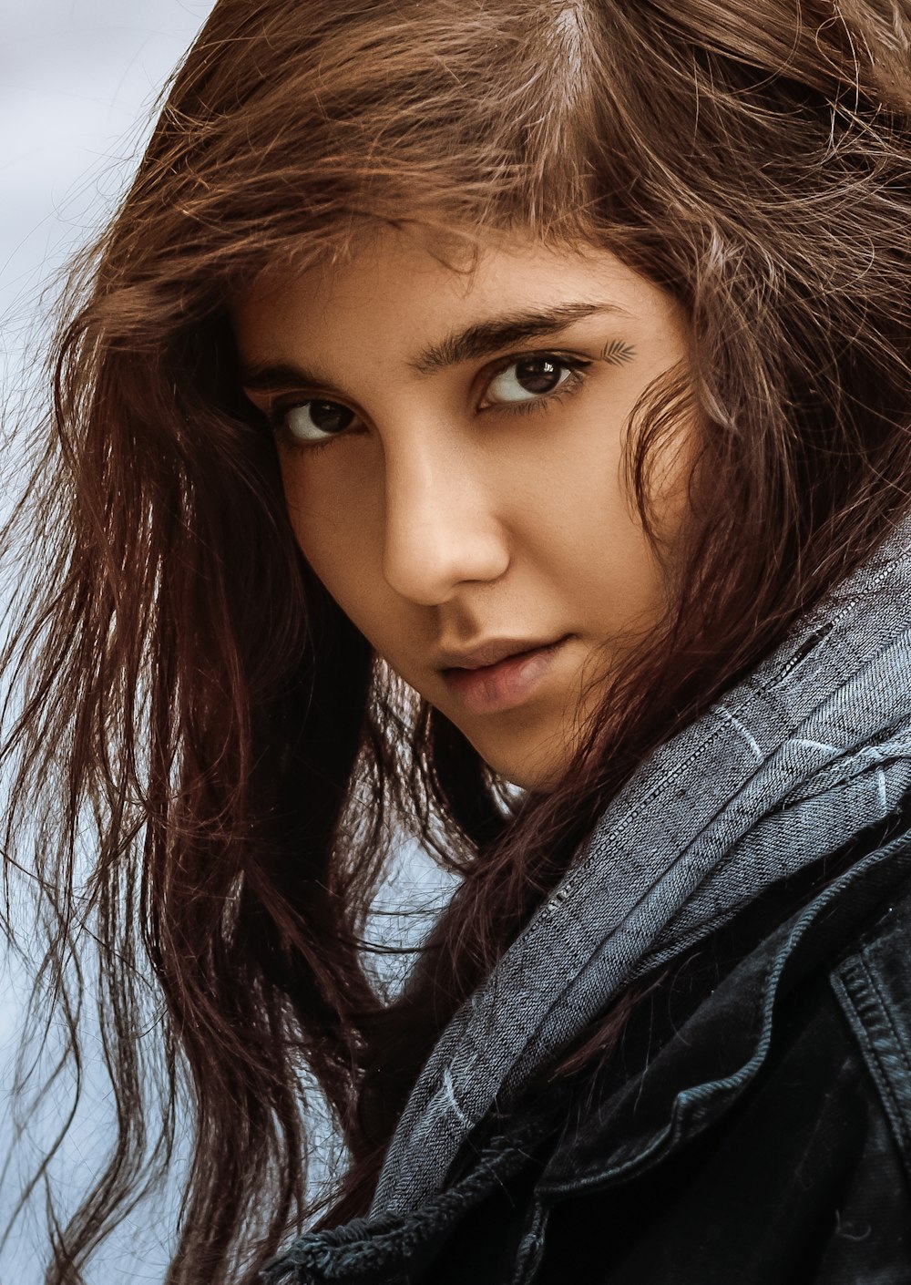 woman in gray scarf and gray coat