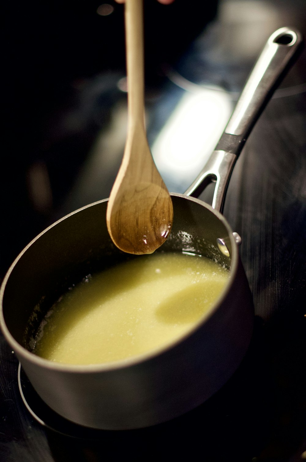 soup in black ceramic bowl