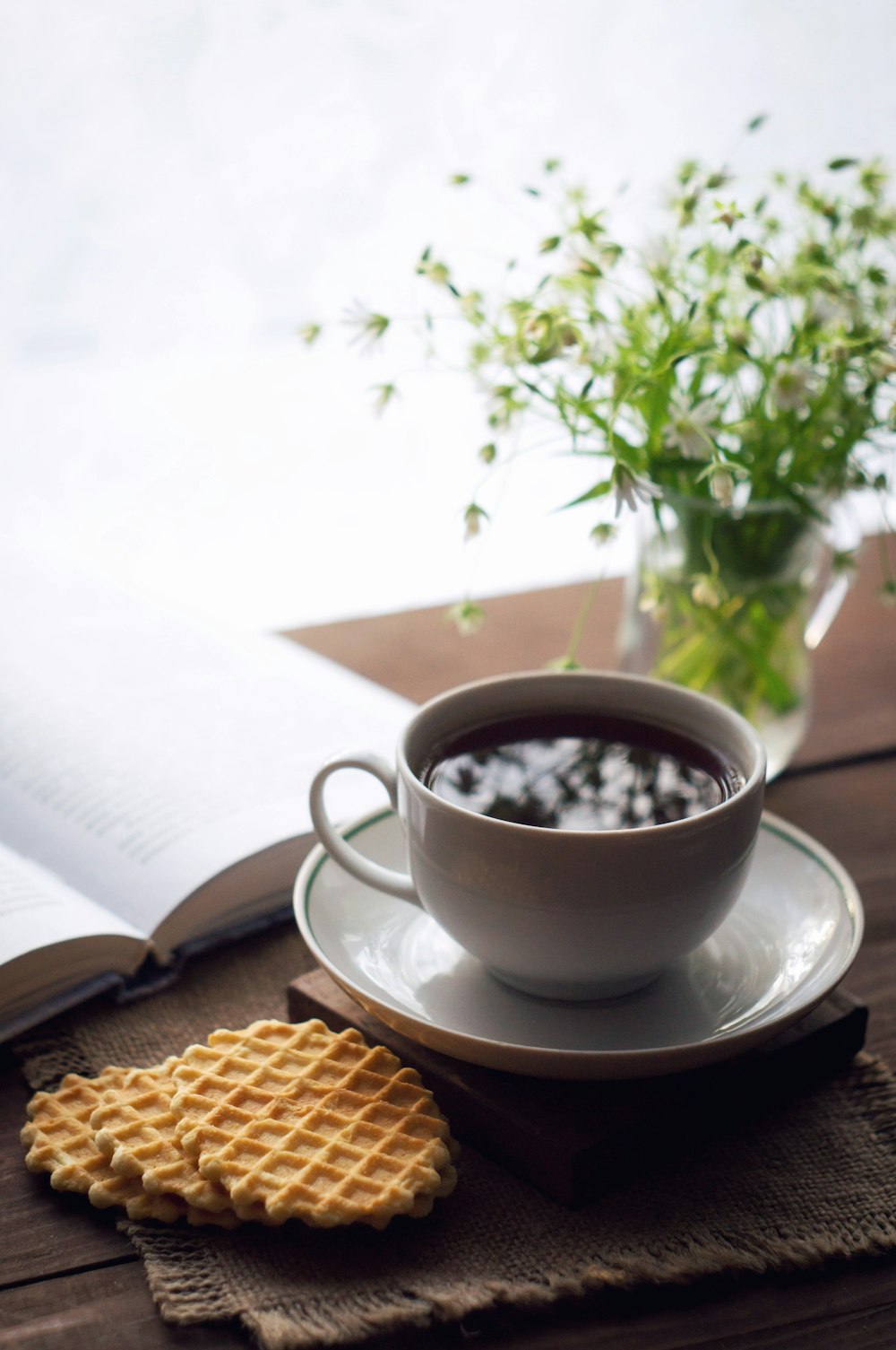 white ceramic cup on white ceramic saucer