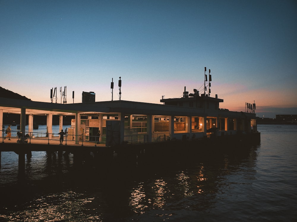 brown concrete building near body of water during daytime