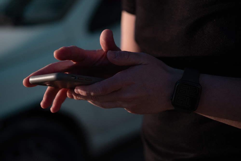 person wearing black smart watch