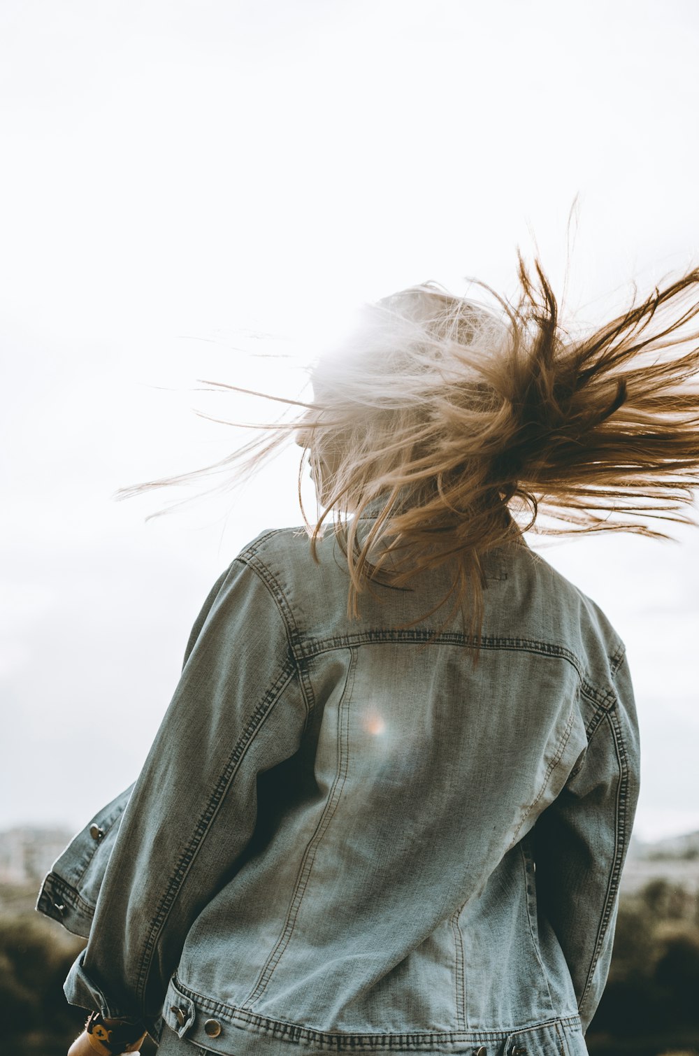 woman in blue denim jacket